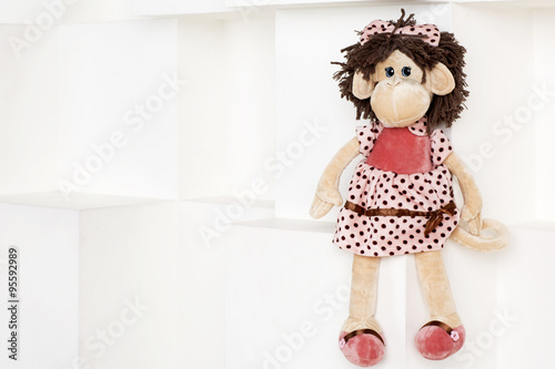 Soft toy monkey on a white background. 