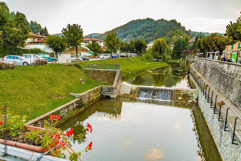 Fototapeta premium river through mountain village in Tuscany