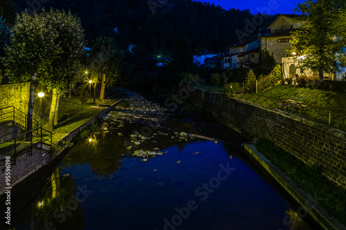 river through mountain village in Tuscany