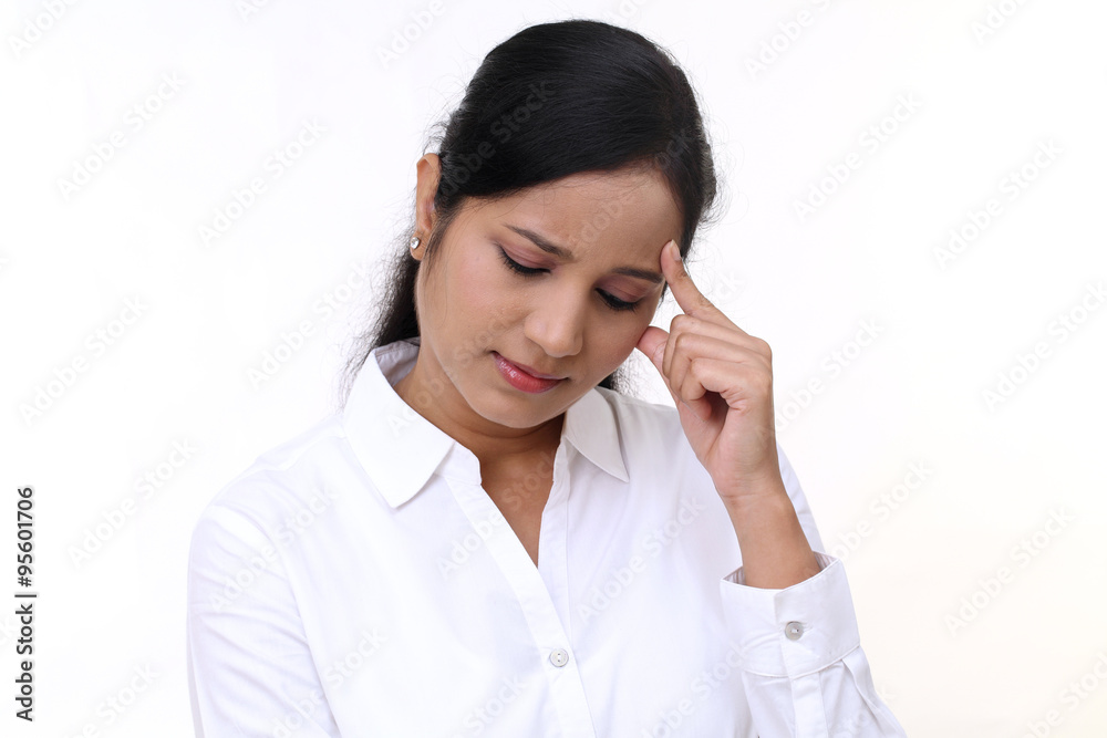 Stressful young business woman against white Stressful young business woman against white