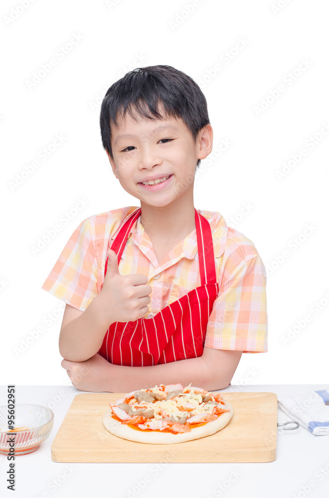 Asian boy cooking pizza on table Asian boy cooking pizza on table