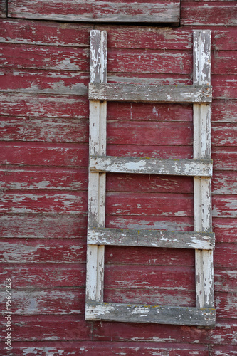 barn ladder on side of old red barn