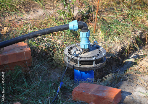 New Installed Water Bore. Pumping air from compressor into from new constructed water bore or well as process of cleaning and filtrating water.
