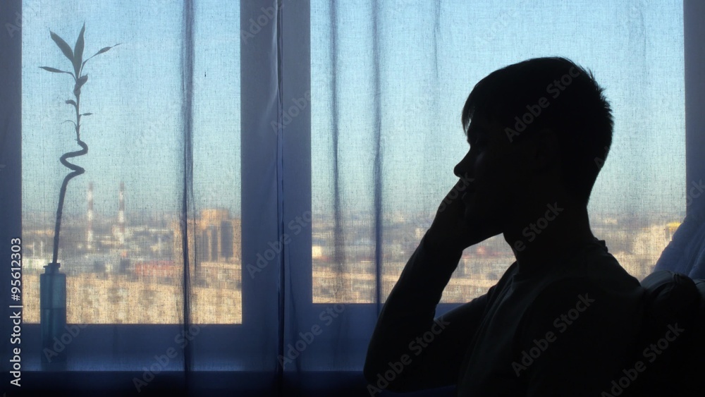 Silhouette man, talking at window background Silhouette man, talking at window background