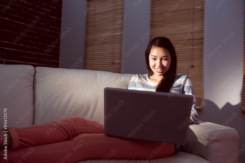 Asian woman using laptop at night Asian woman using laptop at night