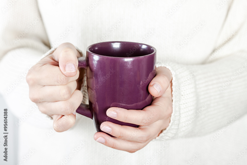 Cup of tea or coffee in female hands Cup of tea or coffee in female hands