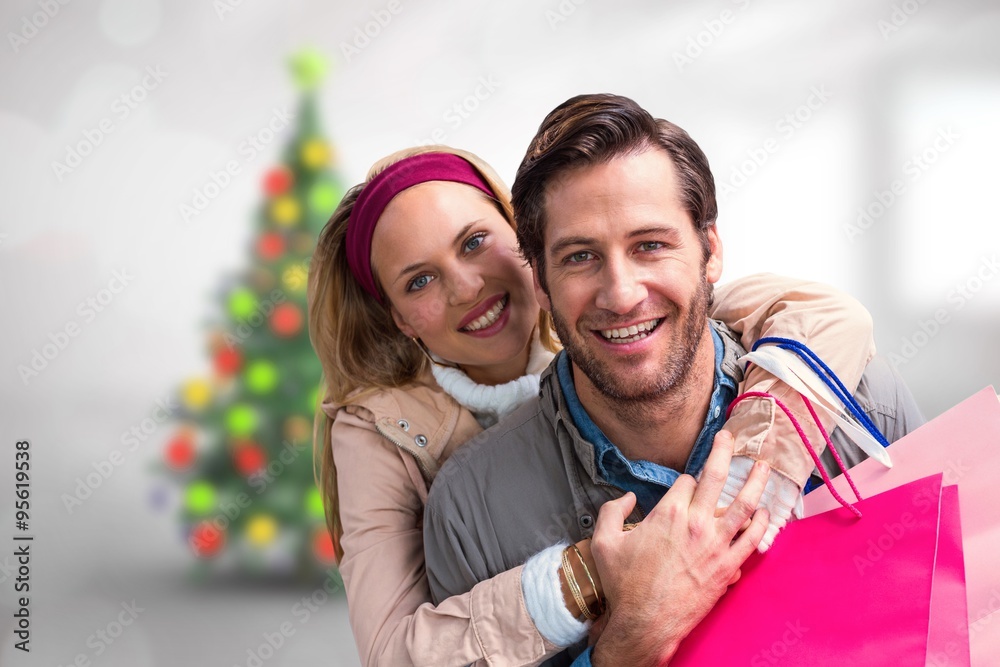 Fototapeta premium Composite image of smiling couple embracing 