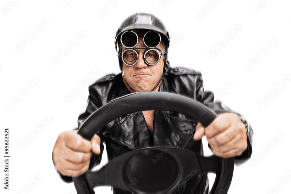 Focused senior driver holding a steering wheel Focused senior driver holding a steering wheel