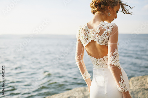 photoshoot lovers in a wedding dress in the mountains near the s