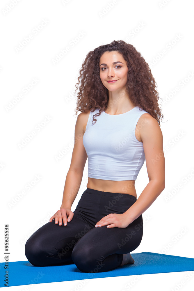 Studio shot of a young fit woman after yoga exercises. Studio shot of a young fit woman after yoga exercises.