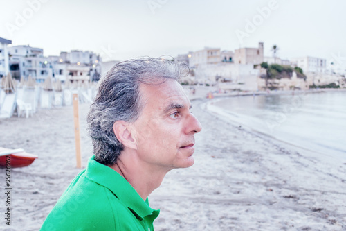 charming man relaxing in a seaside town