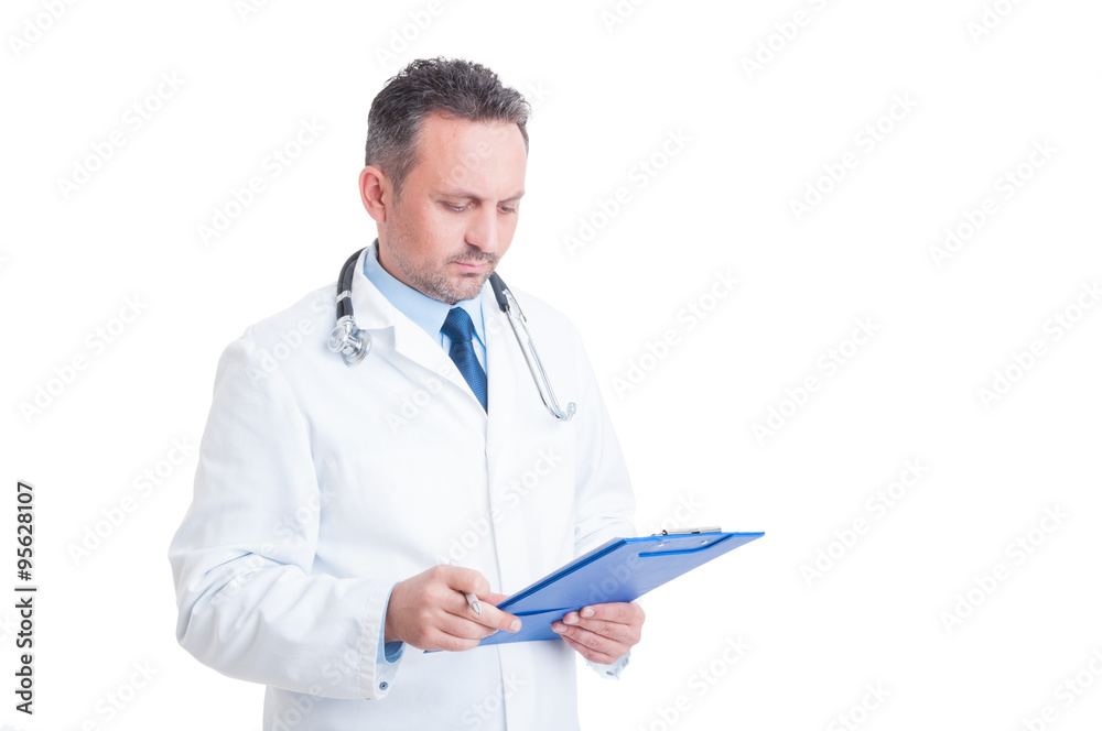 Smart doctor or medic analyzing document on clipboard Smart doctor or medic analyzing document on clipboard
