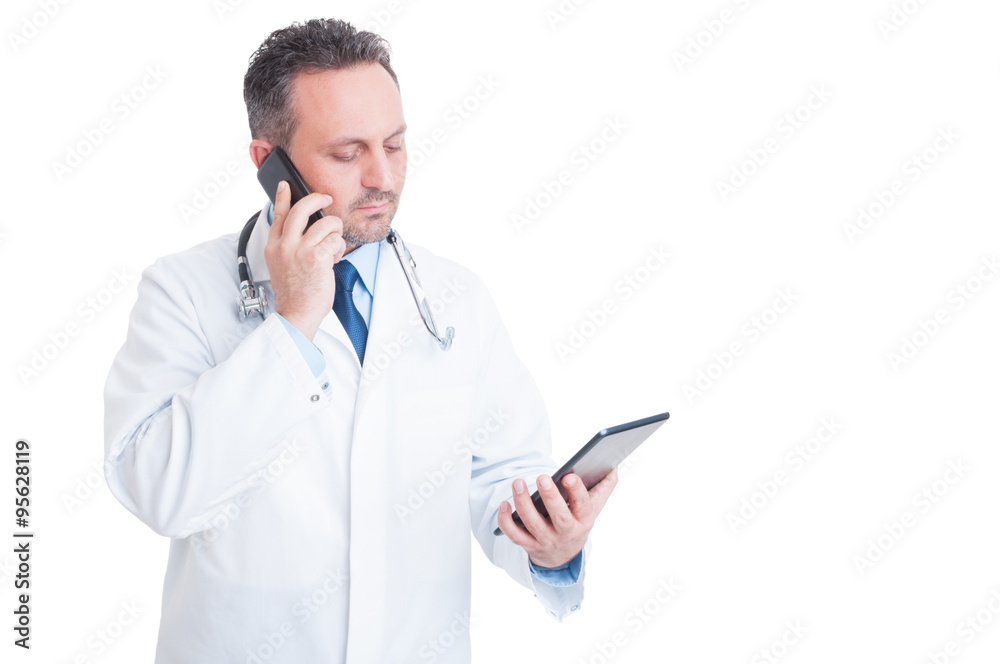 Smart medic or doctor multitasking with phone and tablet Smart medic or doctor multitasking with phone and tablet