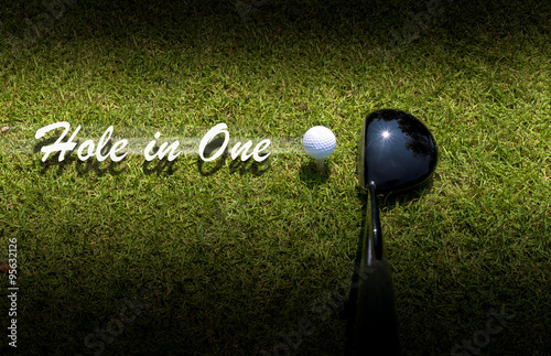 Golf driver driving ball with Hole-in-One caption