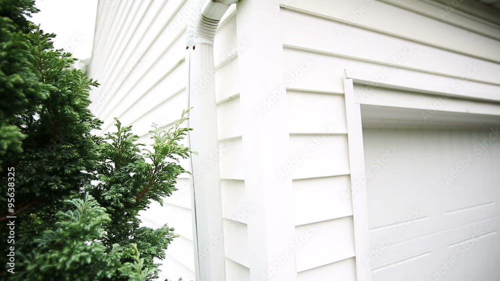 House Gutter Side. 2 shots. camera rises and lowers on the gutter on the corner of a house and garage.
House Gutter Side. 2 shots. camera rises and lowers on the gutter on the corner of a house and garage.