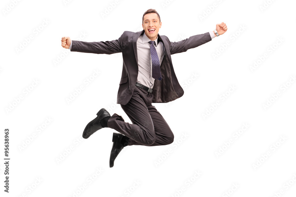 Overjoyed businessman jumping and gesturing happiness