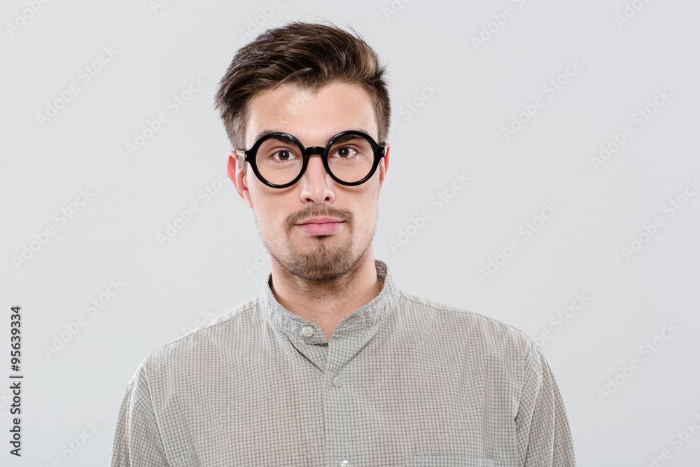 Portrait of handsome confident student in black round glasses Portrait of handsome confident student in black round glasses