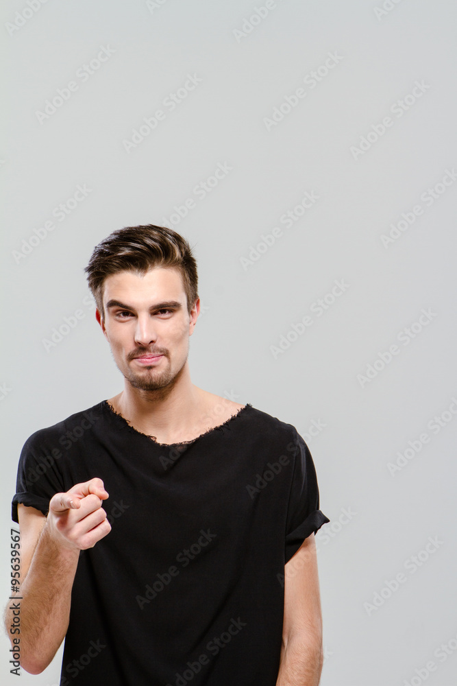 Young charming guy pointing on you Young charming guy pointing on you