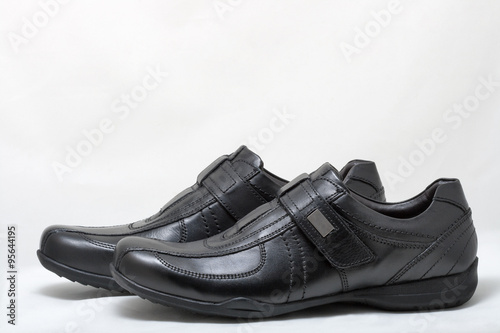 Bild auf Leinwand Black man leather shoes with velcro on white