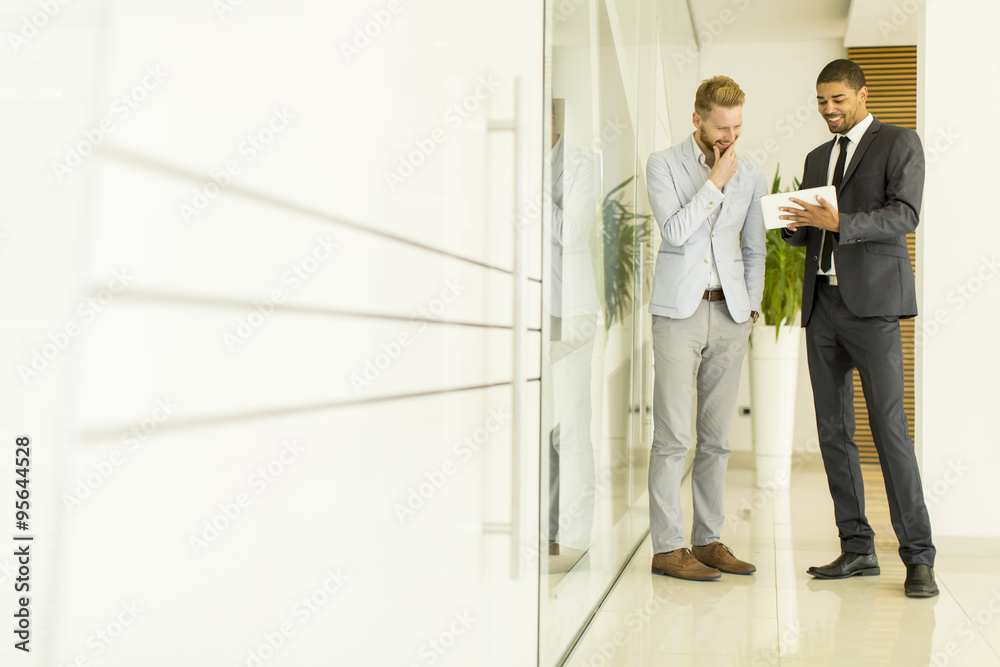 Multiethnic businessmen in the office Multiethnic businessmen in the office