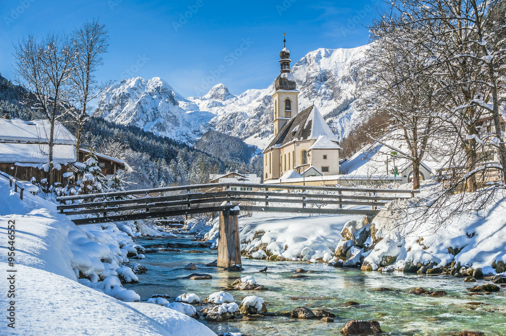 Idyllic mountain winter landscape with famous church and crystal clear river in Ramsau, Berchtesgadener Land, Bavaria, Germany