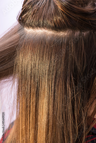 Long straight brown female hair closeup