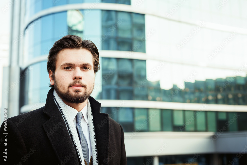 young caucasian businessman near the business center young caucasian businessman near the business center