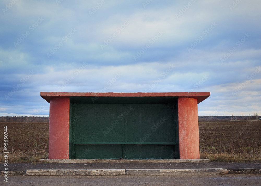 bus stop in the countryside. bus station without people on the road among fields and forests
