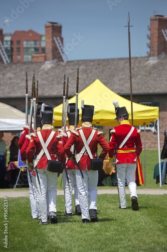 TORONTO - June 20: Men wearing historical military uniform march © vdvtut
