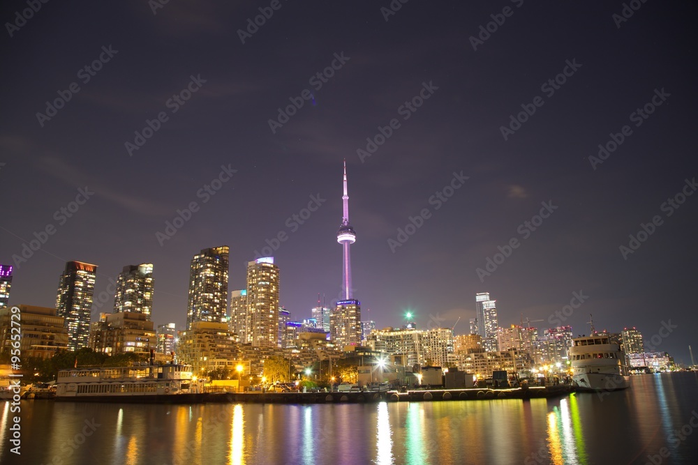 Toronto Skyline at night with a reflection in Lake Ontario