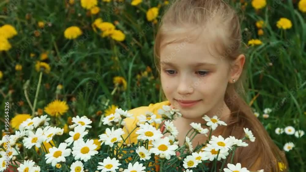 Closeup portrait happy girl and huge bouquet of white flowers. Child looking at camera Closeup portrait happy girl and huge bouquet of white flowers. Child looking at camera
