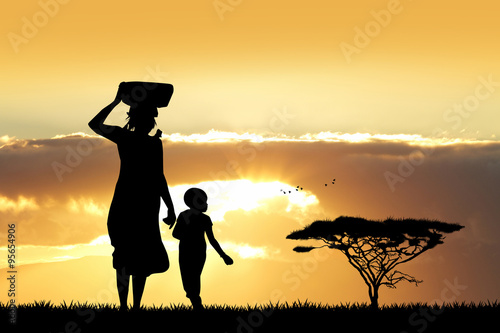 African woman and son at sunset