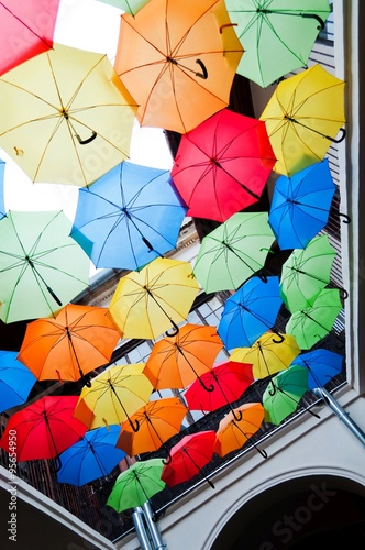 Street decoration with colorful open umbrellas hanging over the alley. Kosice, Slovakia