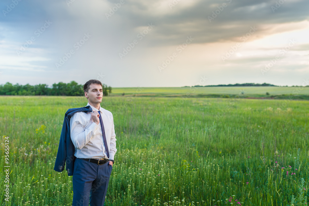 businessman is working in the nature. 