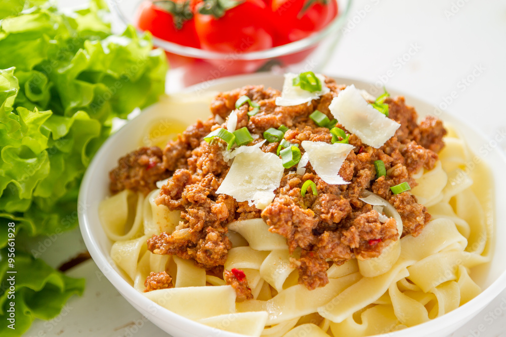 Spaghetti bolognese with salad and tomatoes Spaghetti bolognese with salad and tomatoes