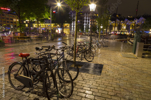 Bicycles parked at night in historical part of Rotterdam, Netherlands