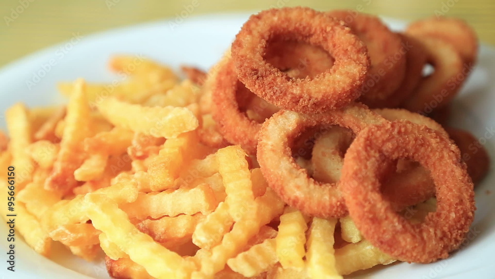 Fried potatoes and onion rings Fried potatoes and onion rings