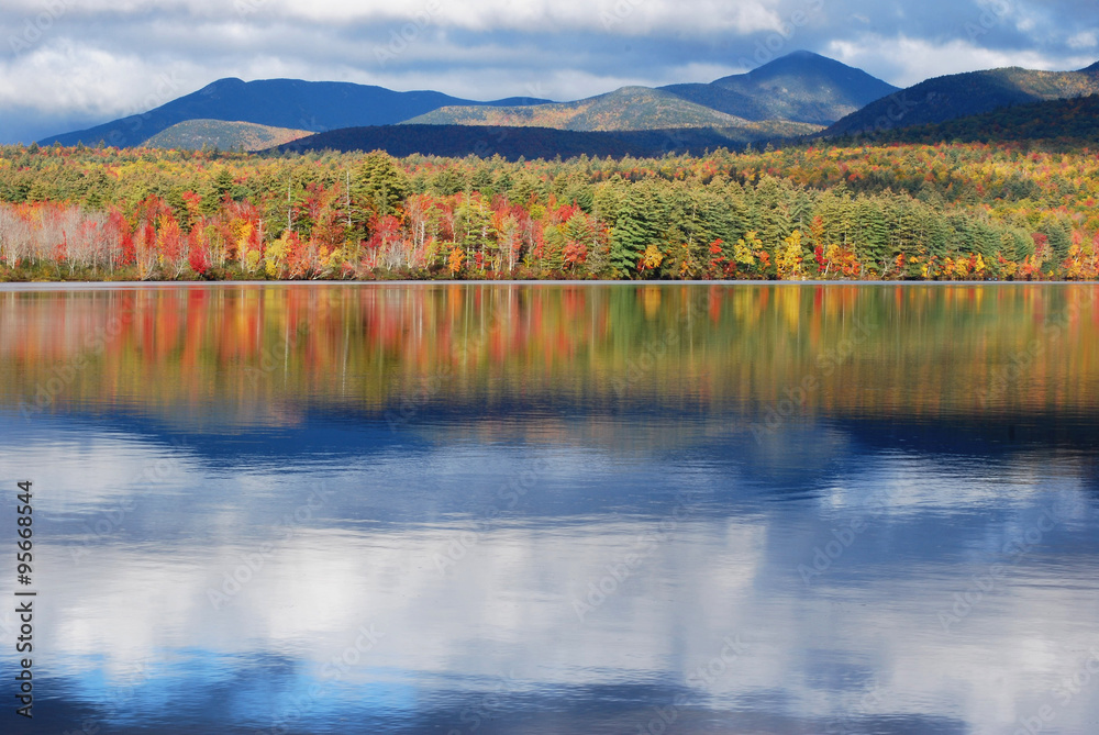 Mirror Image/Chocorua Lake and autumn foliage in the white mountains of New Hampshire, USA. Mirror Image/Chocorua Lake and autumn foliage in the white mountains of New Hampshire, USA.