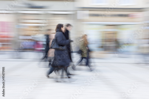 Happy shopping, people walking, motion blur