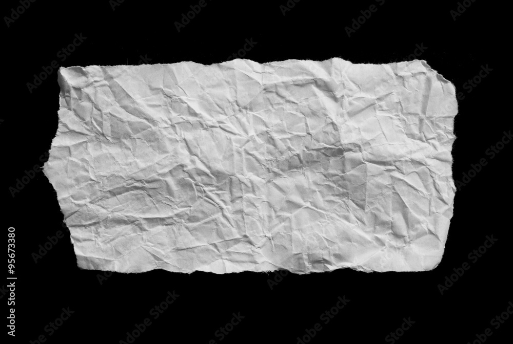 Piece of torn paper on black. Copy space Piece of torn paper on black. Copy space