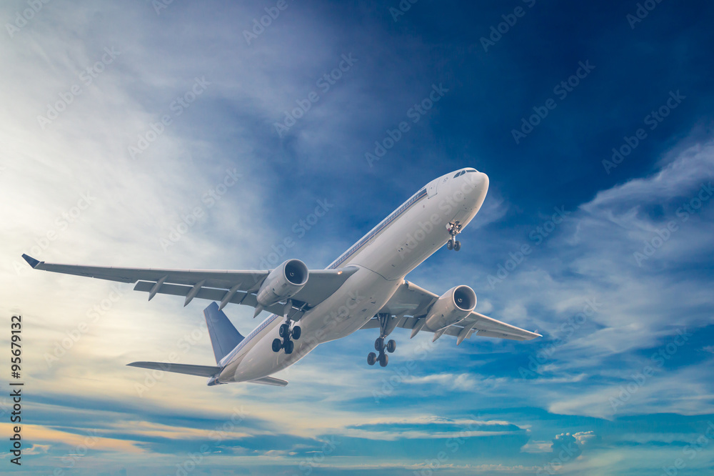 Fototapeta premium Commercial airplane flying with blue sky background
