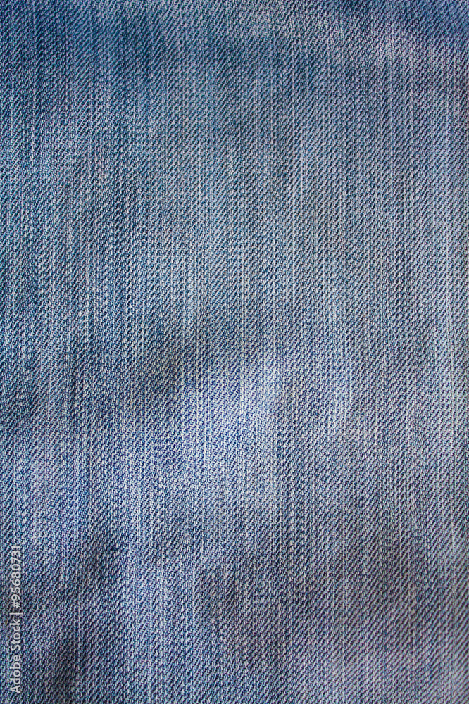 Texture of blue jeans textile close up