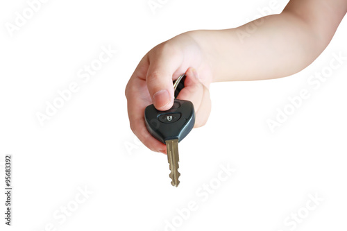 women's hand presses on the remote control car alarm systems