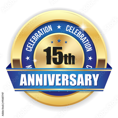 Gold 15th anniversary badge with blue ribbon on white background