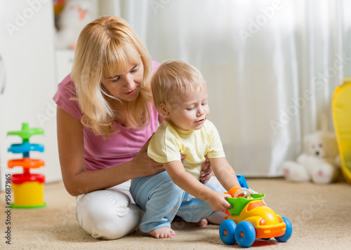Mother and child son play w...