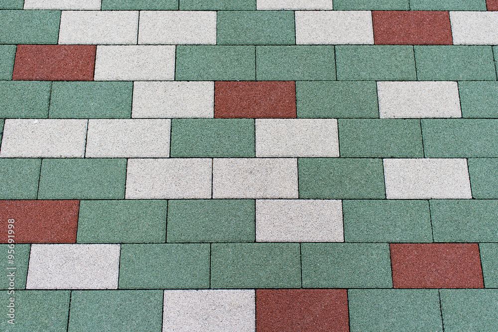 Pavement outdoors floor plates in shades of green , white and red Pavement outdoors floor plates in shades of green , white and red