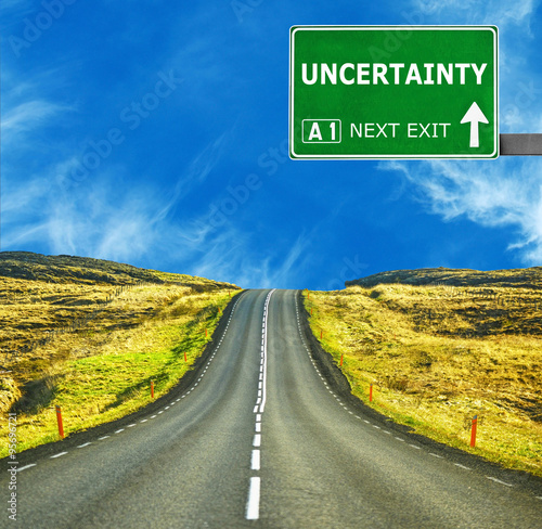 Fotografie UNCERTAINTY road sign against clear blue sky