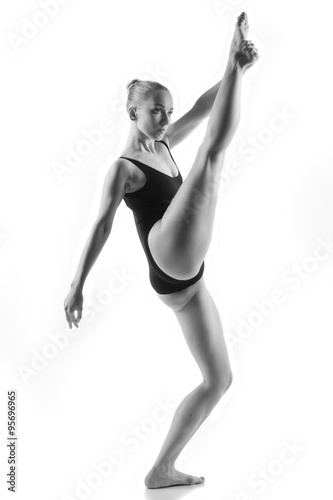 Modern ballet dancer posing on white background © Demian