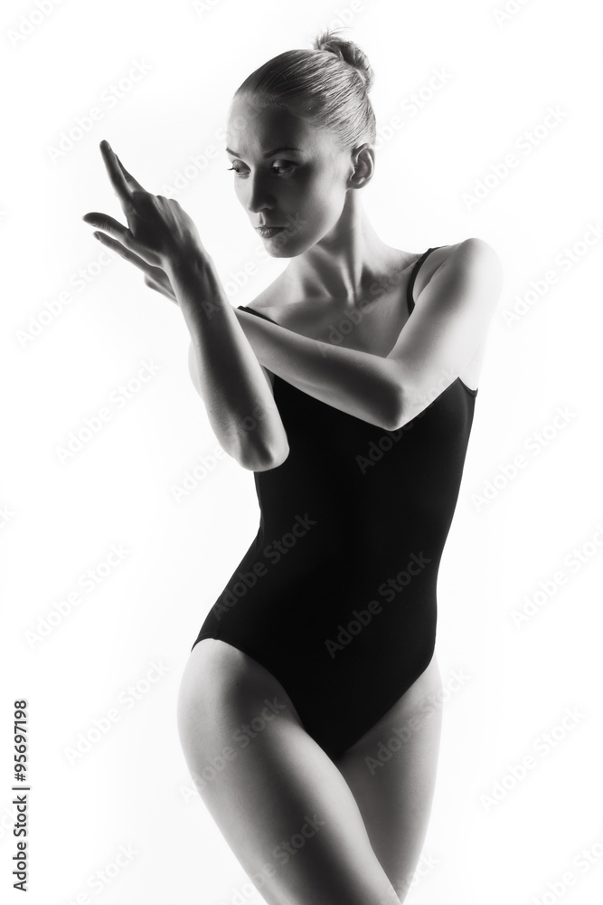 Obraz premium Modern ballet dancer posing on white background