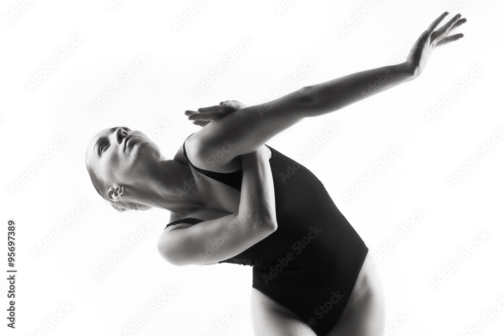 Fototapeta premium Modern ballet dancer posing on white background